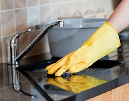 Carpet cleaner preparing safe cleaning equipment before work