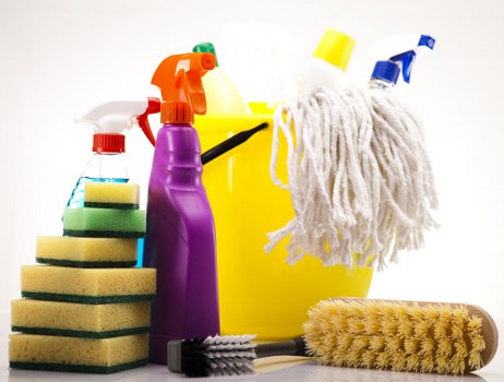 Cleaner working on residential windows in Harrow